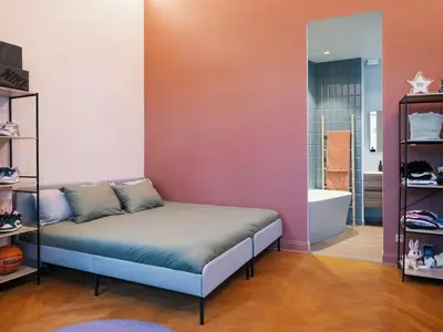 a bedroom with a bed and a bath tub in a room at Appartement Haut Standing coeur de Nice pour 6pers in Nice