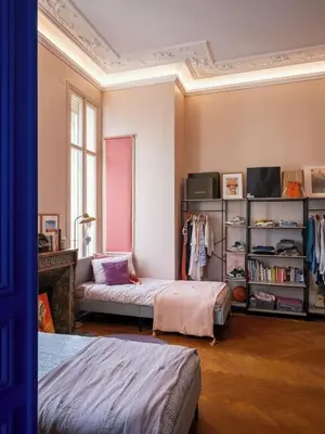 a room with two beds and a book shelf at Appartement Haut Standing coeur de Nice pour 6pers in Nice