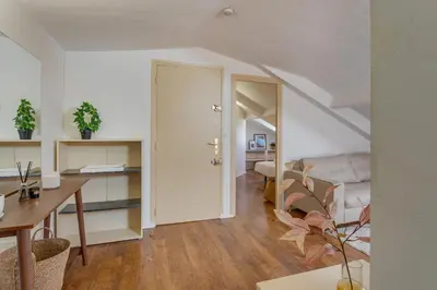 a living room with a table and a dining room at ATTIC URBAN AP4485 by Riviera Holiday Homes in Nice