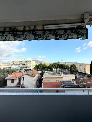a view of a city from a window at Charmant appartement 3 pièces au cœur de Nice in Nice