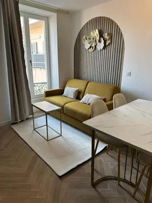 a living room with a couch and a table at MOON 41 - Appartement Nice 4P in Nice