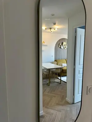 a mirror reflection of a living room with a table at MOON 41 - Appartement Nice 4P in Nice