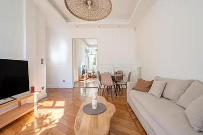 a living room with a couch and a table at Soleil Niçois Terracotta in Nice