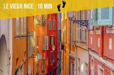 a view of a city street with a yellow sign at Soleil Niçois Terracotta in Nice