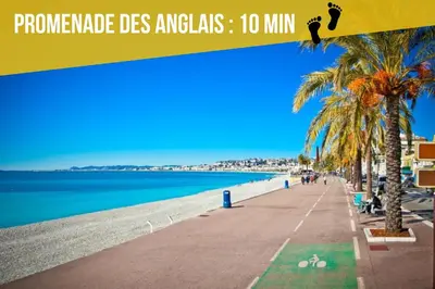 a beach with a sign that reads promega des angels min at Soleil Niçois Terracotta in Nice
