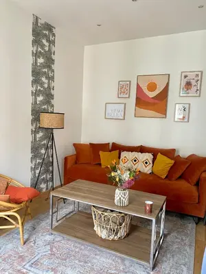 a living room with a couch and a coffee table at 2 pièces avec balcon au port de Nice in Nice