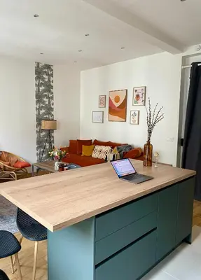 a kitchen with a counter with a laptop on it at 2 pièces avec balcon au port de Nice in Nice