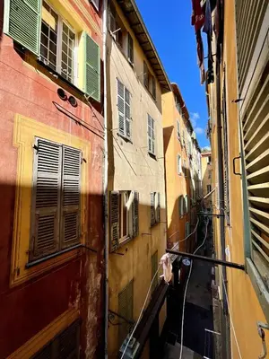 an alley in an italian city with buildings at Studio Vieux-Nice proche de la mer et Cours Saleya in Nice
