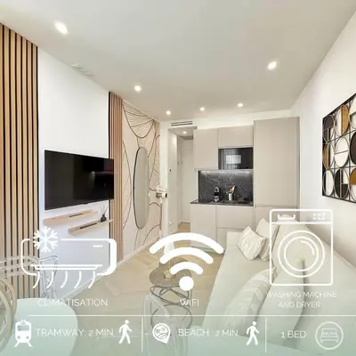 a bedroom with a bed and a tv in a room at Studio sur la promenade des anglais in Nice
