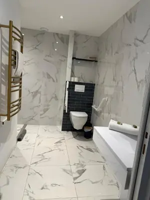 a white bathroom with a toilet and a sink at MOON 24 - Appartement Nice 6P in Nice