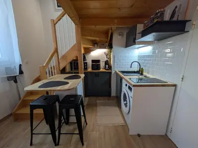 a small kitchen with a sink and a washing machine at Palais des arts in Nice