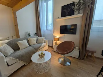 a living room with a couch and a table at Palais des arts in Nice