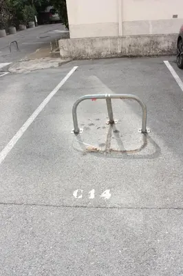 a bike rack in a parking lot at Le Cocon Niçois Studio Cozy et Lumineux avec Parking in Nice