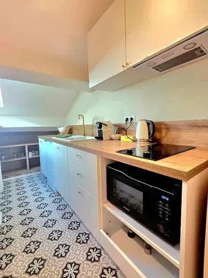 a kitchen with a sink and a stove top oven at Design et confort - Nice Centre 4 pers in Nice