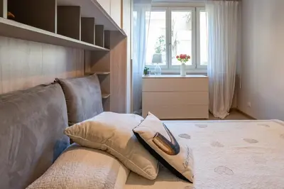 a living room with a couch and a window at chloe in Beaulieu-sur-Mer