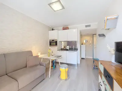 a living room with a couch and a table at Nestor&Jeeves - FIORI SALEYA - Old town - Close sea in Nice