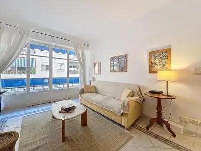 a living room with a couch and a table at Nestor&Jeeves - LADY BLUE - Terrace - Close sea in Nice