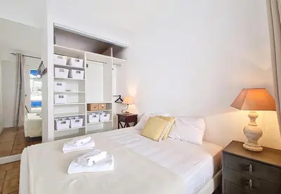 a bedroom with a large white bed and a lamp at Nestor&Jeeves - LADY BLUE - Terrace - Close sea in Nice