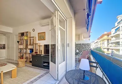 a room with a balcony with a table and a chair at Nestor&Jeeves - LADY BLUE - Terrace - Close sea in Nice