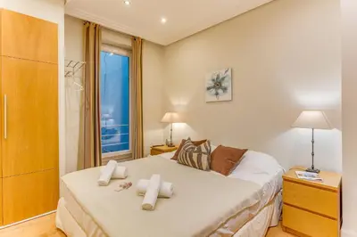 a bedroom with a large bed with towels on it at VUE MAGENTA AP4484 by Riviera Holiday Homes in Nice