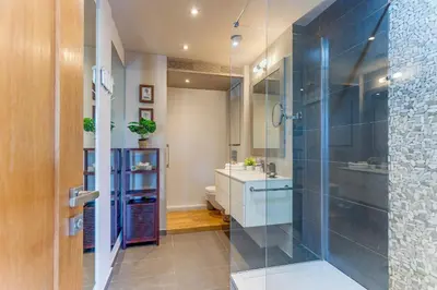 a bathroom with a glass shower and a sink at VUE MAGENTA AP4484 by Riviera Holiday Homes in Nice