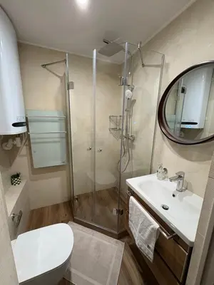 a bathroom with a shower and a toilet and a sink at Perle au Port de NICE in Nice