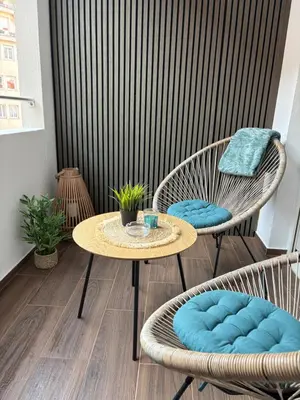 a patio with a table and two chairs at Perle au Port de NICE in Nice