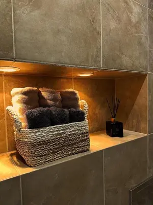 a shelf with a basket of towels in a bathroom at Appartement La Promenade Des Anglais in Nice