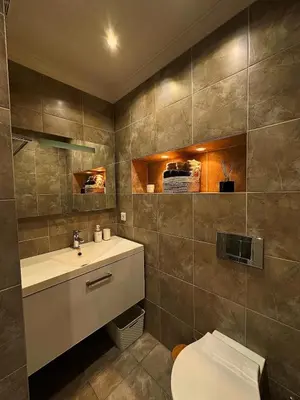 a bathroom with a toilet and a sink at Appartement La Promenade Des Anglais in Nice