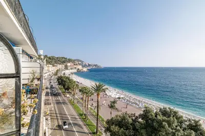 a view of a beach and the ocean from a building at Outstanding View on the Promenade - Awesome 2 Bdr in Nice