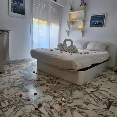 a bedroom with a bed with flowers on the floor at Nice Studio proche mer in Nice