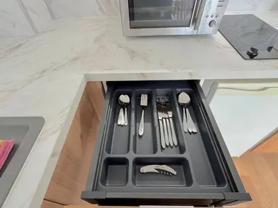 a kitchen counter with a stove with utensils on it at ⁂ Petit nid design au centre de Nice in Nice