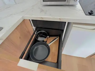 a stove with a pan in the middle of a kitchen at ⁂ Petit nid design au centre de Nice in Nice