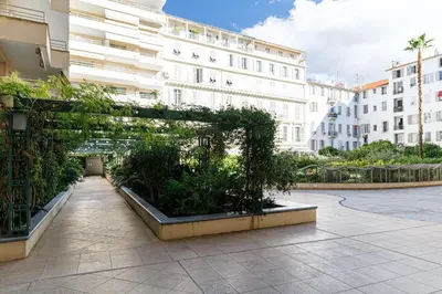 a garden in a courtyard in front of a building at MY CASA - PALAIS MED 702 D - 2 bedroom Down Town with Terasse AC in Nice