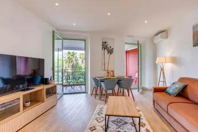 a living room with a couch and a table at NID MASSENA AP4486 by RIVIERA HOLIDAY HOMES in Nice