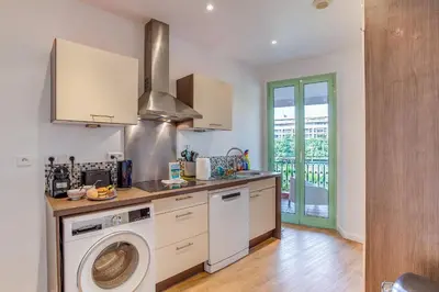 a kitchen with a washer and a washing machine at NID MASSENA AP4486 by RIVIERA HOLIDAY HOMES in Nice