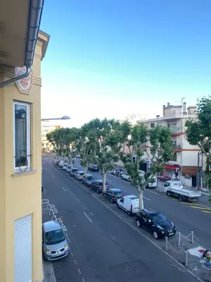 a view of a street with cars parked on the road at Zgondoiu Résidence in Nice