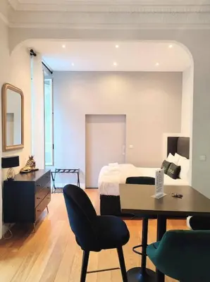 a bedroom with a bed and a desk and a chair at Studio in the heart of Nice close to amenities in Nice