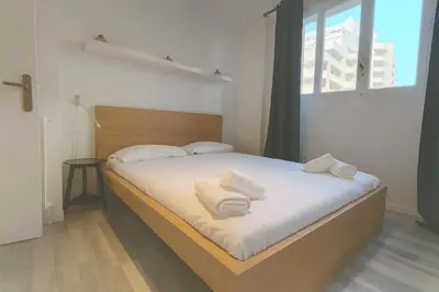 a bedroom with a bed with white towels on it at Stella Monte 1 AC WiFi 4 Pers in Nice