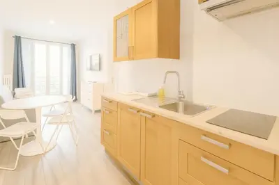 a kitchen with a sink and a table at Stella Monte 1 AC WiFi 4 Pers in Nice
