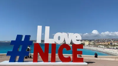 a sign with the words love nife in front of a beach at Le Carré D'or 2 Pers Centrale WiFi AC in Nice