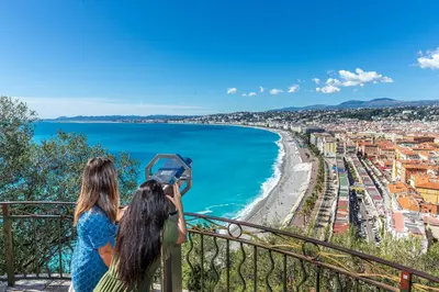 two women taking a picture of the ocean at Le Carré D'or 2 Pers Centrale WiFi AC in Nice