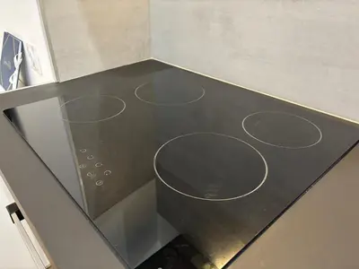 a stove top oven with three circles on it at Au cœur du Vieux Nice, superbe studio refait à neuf in Nice