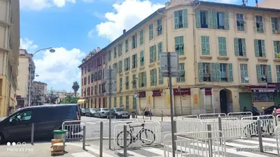 a building with a bike parked in front of a street at chambre en colocation appartement partagé moyenne durée 1 in Nice