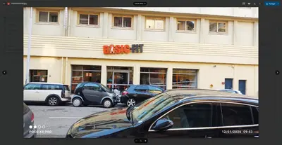 a building with cars parked in a parking lot at chambre en colocation appartement partagé moyenne durée 1 in Nice