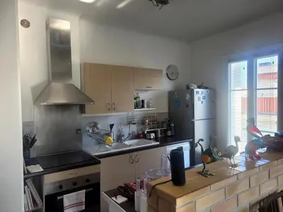 a kitchen with a sink and a refrigerator at Apartment nice view in Nice