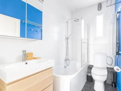 a bathroom with a tub and a toilet and a sink at Apartment in Nice