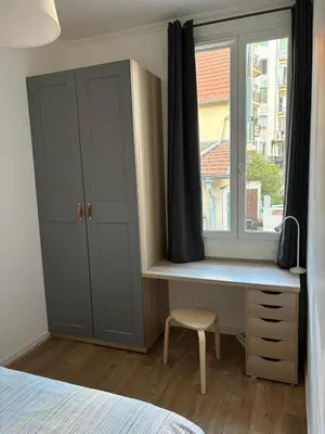 a bedroom with a desk and a window at Apartment in Nice