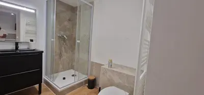 a bathroom with a shower with a toilet and a sink at Charmant studio sur la Promenade des Anglais in Nice