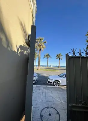a car parked in a parking lot next to a building at Charmant studio sur la Promenade des Anglais in Nice